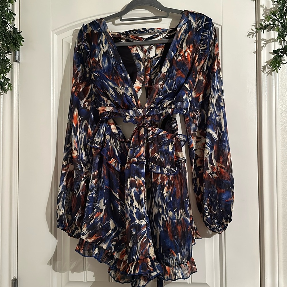 NEW WITH TAGS AKIRA LONG SLEEVE ROMPER WORH OPENINGS ON THE SIDES